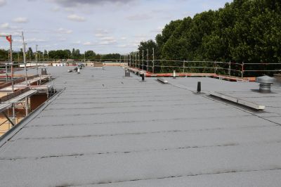 Flat Roof Repair After Storm Or Wind Damage